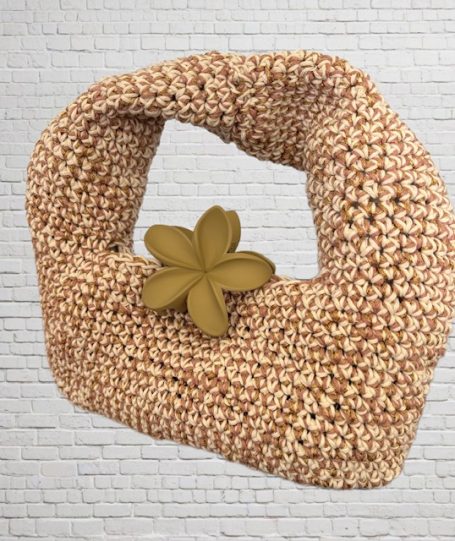 CROCHET PATTERN for Donut Crochet Bag Woven straw bag with a decorative flower accent on a textured background.